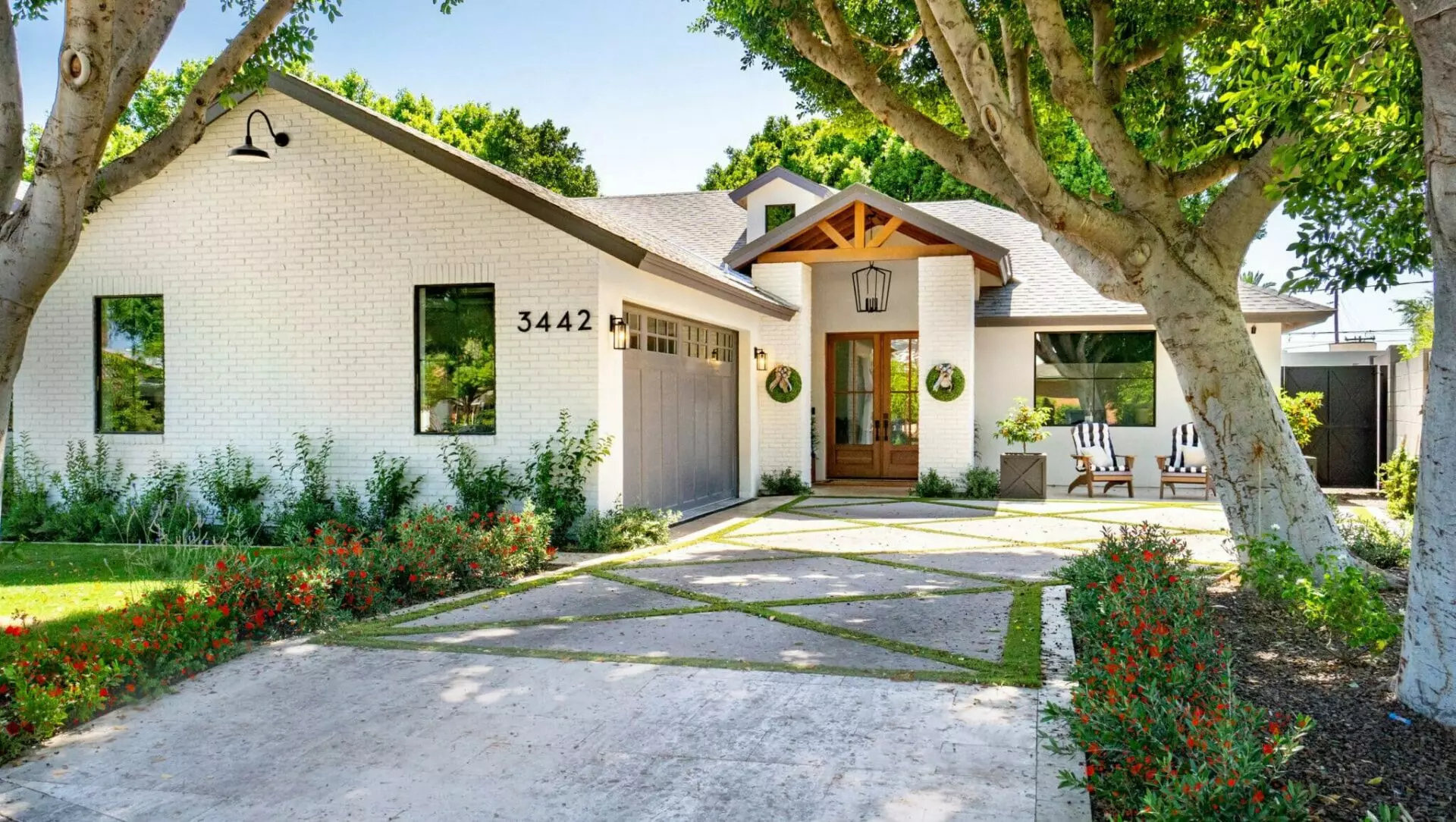 Home-front-view-garage-tree-chairs-and-porch-home insurance in Michigan