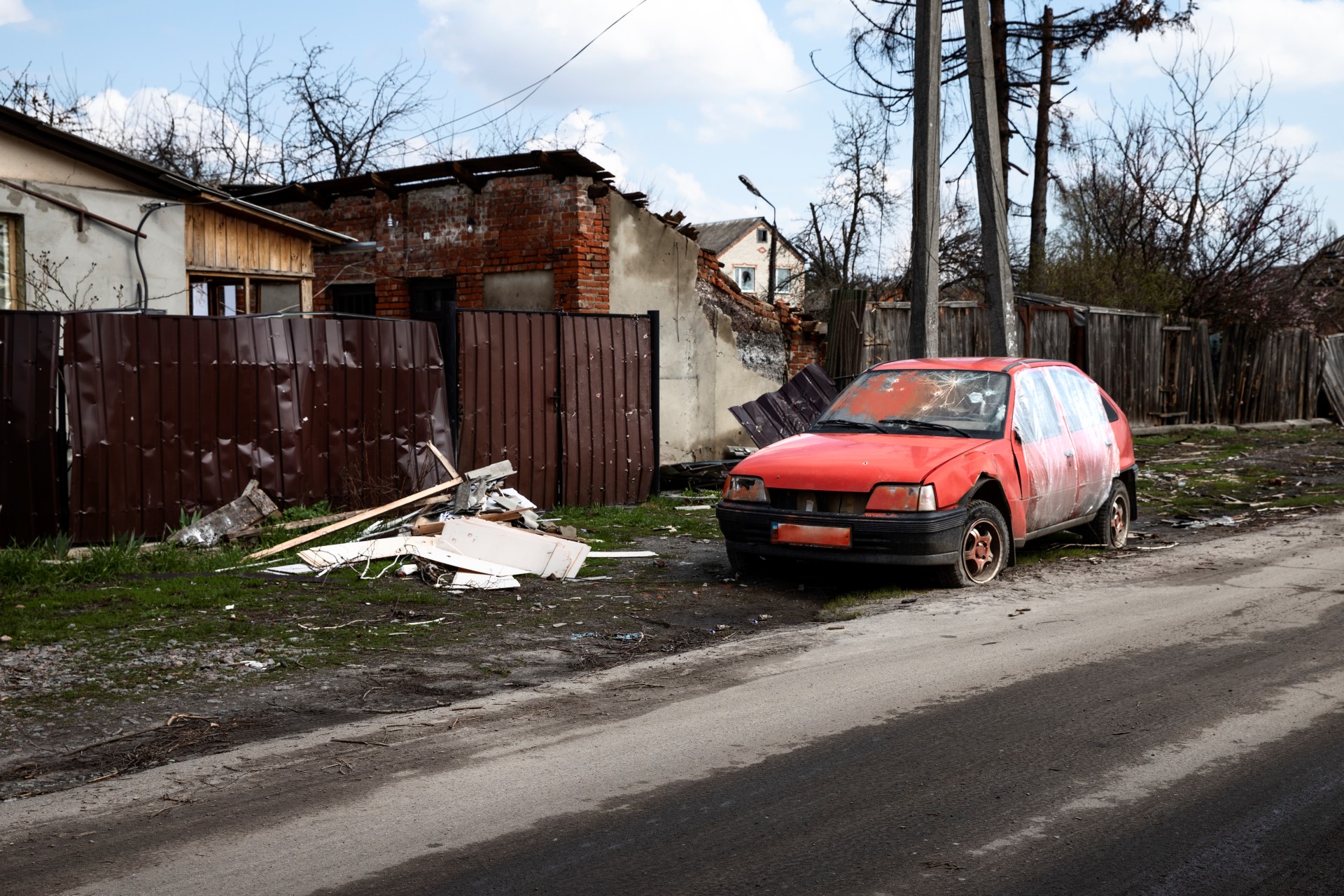 broken-red-car-russian-natural-disaster-Car Insurance Michigan