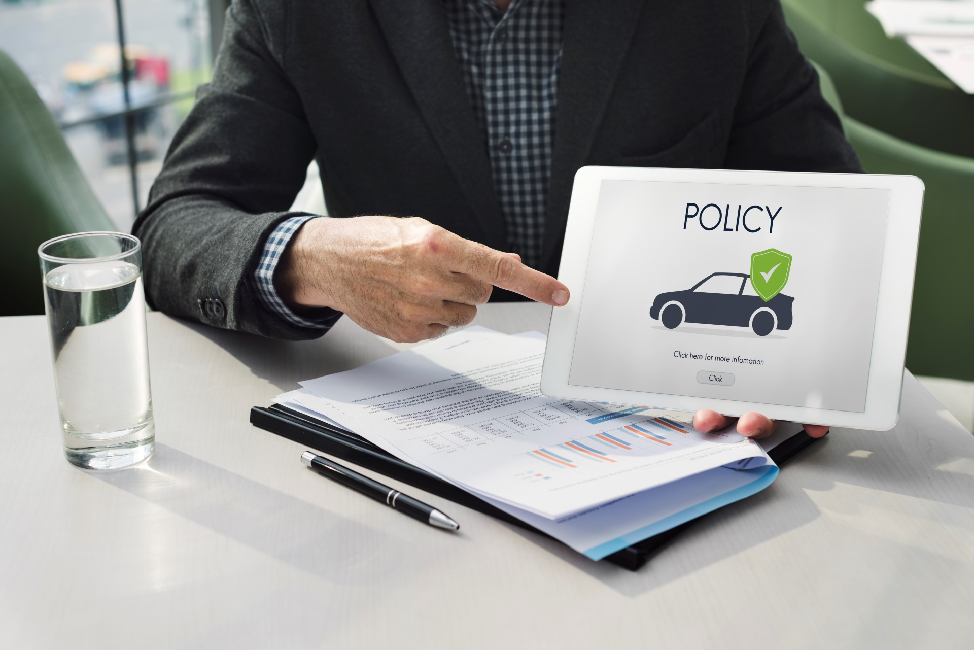 Car Insurance Michigan-a person holding a printed car insurance icon with documentation underneath-Car Insurance Michigan-car insurance detroit