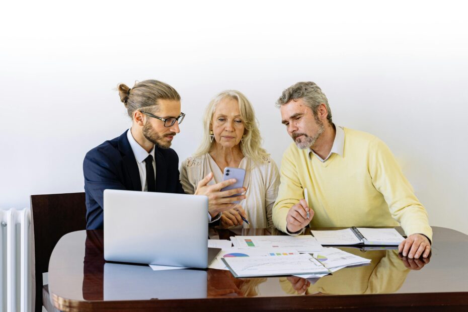 Agent discussing policy with senior male and female client-Car Insurance in Michigan-Comprehensive Car Insurance in Michigan
